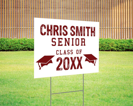 Custom graduation yard sign with a distressed-style font in bold red, featuring personalized senior name, class year, and graduation cap icons. Printed on durable Coreplast plastic, available in custom colors and single or double-sided print, perfect for high school and college graduates. Maroon