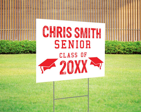 Custom graduation yard sign with a distressed-style font in bold red, featuring personalized senior name, class year, and graduation cap icons. Printed on durable Coreplast plastic, available in custom colors and single or double-sided print, perfect for high school and college graduates. Red