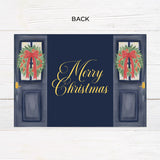 Personalized Doorway to Christmas gatefold card featuring navy blue doors decorated with festive evergreen wreaths, red bows, and elegant gold Merry Christmas lettering. The doors open to reveal a family photograph with a customizable holiday greeting and family name. - back.