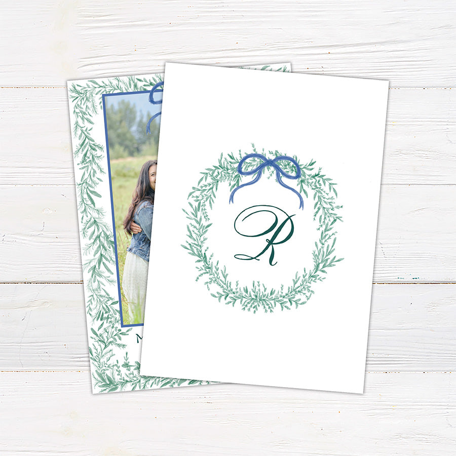 Back - Personalized family Christmas photo card framed with delicate watercolor greenery and an elegant bow.
