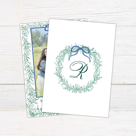 Back - Personalized family Christmas photo card framed with delicate watercolor greenery and an elegant bow.