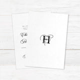 Elegant black and white wedding invitation with entwined initials monogram and formal typography - back side