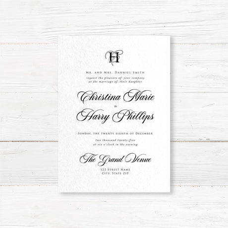 Elegant black and white wedding invitation with entwined initials monogram and formal typography