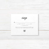 Classic black and white wedding RSVP card with elegant serif font and minimalist design