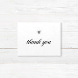 Elegant black and white thank you card with monogram and serif font for wedding gratitude