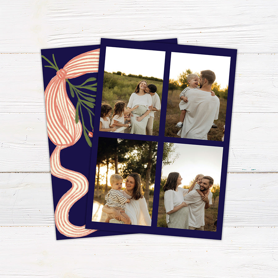 Personalized Christmas card featuring festive mistletoe, berries, striped ribbon, and a Merry Christmas greeting. The reverse features a four-photo family collage for sharing favorite memories. back