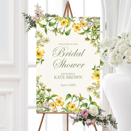 Bridal shower welcome sign featuring a watercolor floral garland in yellow and green, printed on high-quality material for a stylish entrance.