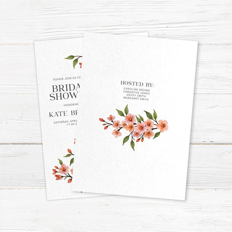 Bridal shower invitation featuring a watercolor cherry blossom vine with soft pink flowers and green leaves, printed on premium cardstock. Back