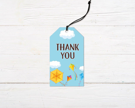 Colorful kite-themed favor tag  featuring bright kites, fluffy clouds, and playful typography on a blue sky background. Perfect for an outdoor, spring, or summer birthday party.