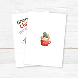 Festive Christmas greeting card featuring a gnome in a red cocoa mug with candy canes and gingerbread cookies. Cheerful watercolor holiday design. - back