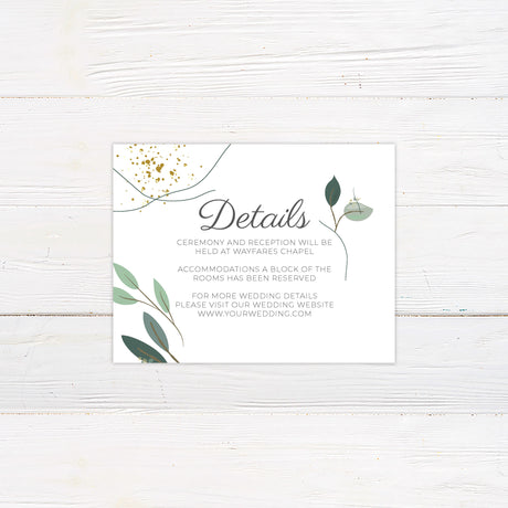 Gold flake greenery wedding details card with modern green botanical leaves, curved line accents, and decorative gold flakes. The card includes space for venue, accommodations, and wedding website information.