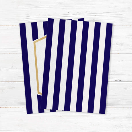 Wedding invitation with navy blue stripes, gold border, and modern white center panel with serif and handwritten fonts - back side