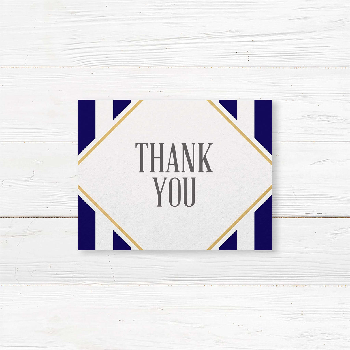 Thank you card with navy stripes, gold frame, and white center panel for handwritten notes