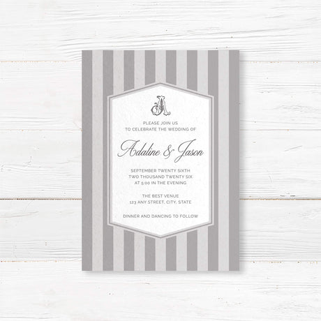 Gray striped wedding invitation with monogram crest, white panel, and classic serif and script fonts