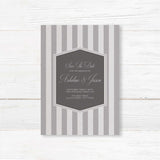 Save the Date card with gray stripes, monogram crest, and elegant serif script fonts