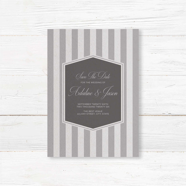 Save the Date card with gray stripes, monogram crest, and elegant serif script fonts