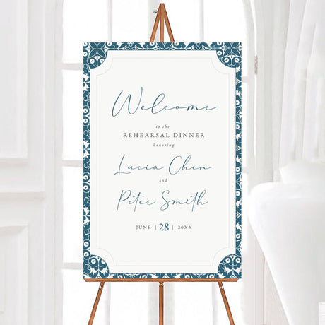 Elegant rehearsal dinner welcome sign with a blue and white ornate border. Features stylish script text displaying event details. Perfect for greeting guests at the venue entrance.