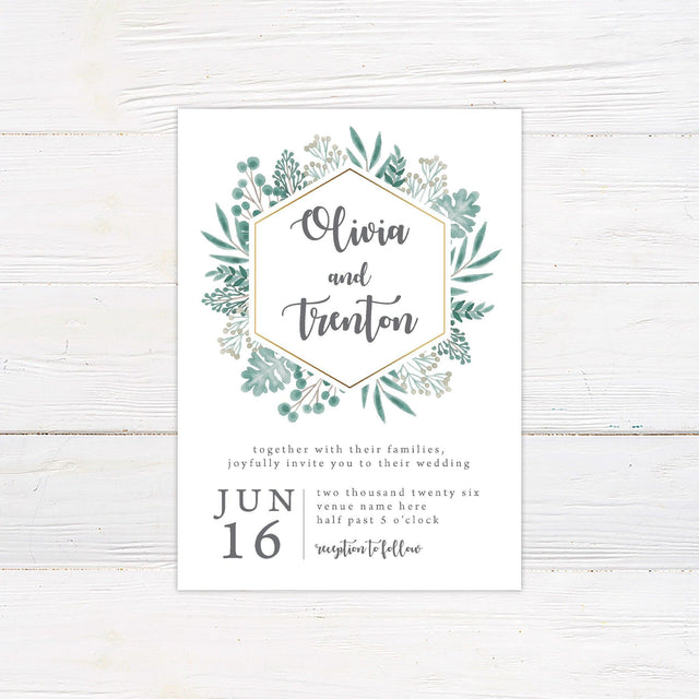 A wedding invitation with a white background features a modern hexagonal frame accented with a gold outline, surrounded by lush watercolor greenery. The couple’s names are displayed in elegant script inside the frame, while the event details, including the date, time, and venue, are arranged in a stylish serif and script font combination below. This design exudes a fresh, botanical feel, perfect for nature-inspired, rustic, or minimalist weddings.