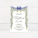 Elegant pear greenery Christmas luncheon invitation framed with watercolor greenery, golden pears, delicate flowers, and a navy bow. The invitation includes personalized host, date, RSVP, and event location information.