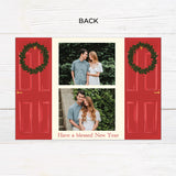 Personalized Home for the Holidays Christmas gatefold photo card featuring festive red double doors decorated with evergreen wreaths and customizable family photos. The folding holiday card opens to reveal a large photo and personalized Christmas greeting with an additional four-photo collage. Two-photo variant. - back