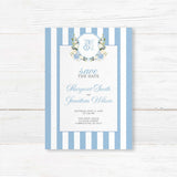 Save the Date card featuring powder blue and white vertical stripes, floral monogram crest with hydrangeas and roses, and elegant fonts, ideal for spring or garden weddings.