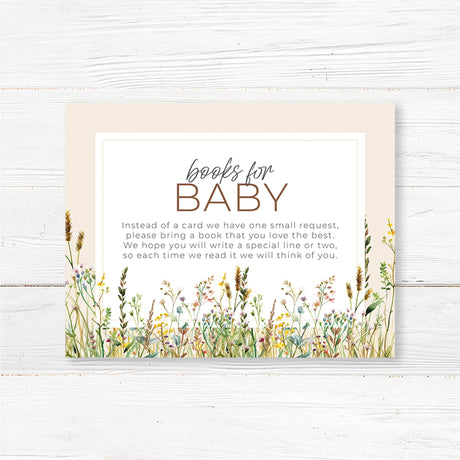 A small card with a soft, neutral background featuring a delicate floral or whimsical design. The text is in an elegant mix of script and serif fonts, kindly requesting guests to bring a book instead of a card for the baby. It may include a short poem or message explaining that the book will be cherished and help build the baby’s library. The design complements a baby shower theme with a warm and inviting feel."

