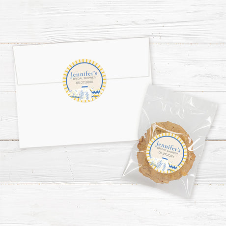 Tea party bridal shower sticker featuring a blue and gold teapot and teacup design, perfect for favors, gifts, and envelope seals.