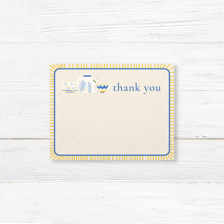 Bridal shower thank-you card featuring blue and gold teapot and teacup illustrations, printed on premium cardstock for an elegant tea party theme.