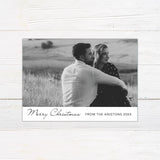 Personalized black and white Christmas photo card featuring a large couple's portrait with an elegant Merry Christmas greeting. The reverse includes multiple photo spaces for sharing additional favorite memories.