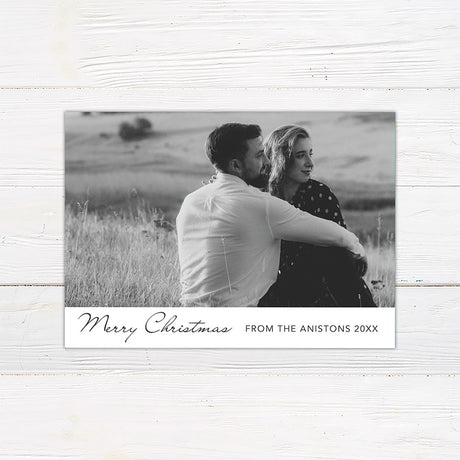 Personalized black and white Christmas photo card featuring a large couple's portrait with an elegant Merry Christmas greeting. The reverse includes multiple photo spaces for sharing additional favorite memories.