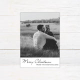 Personalized black and white Christmas photo card featuring a large couple's portrait with an elegant Merry Christmas greeting. The reverse includes multiple photo spaces for sharing additional favorite memories.