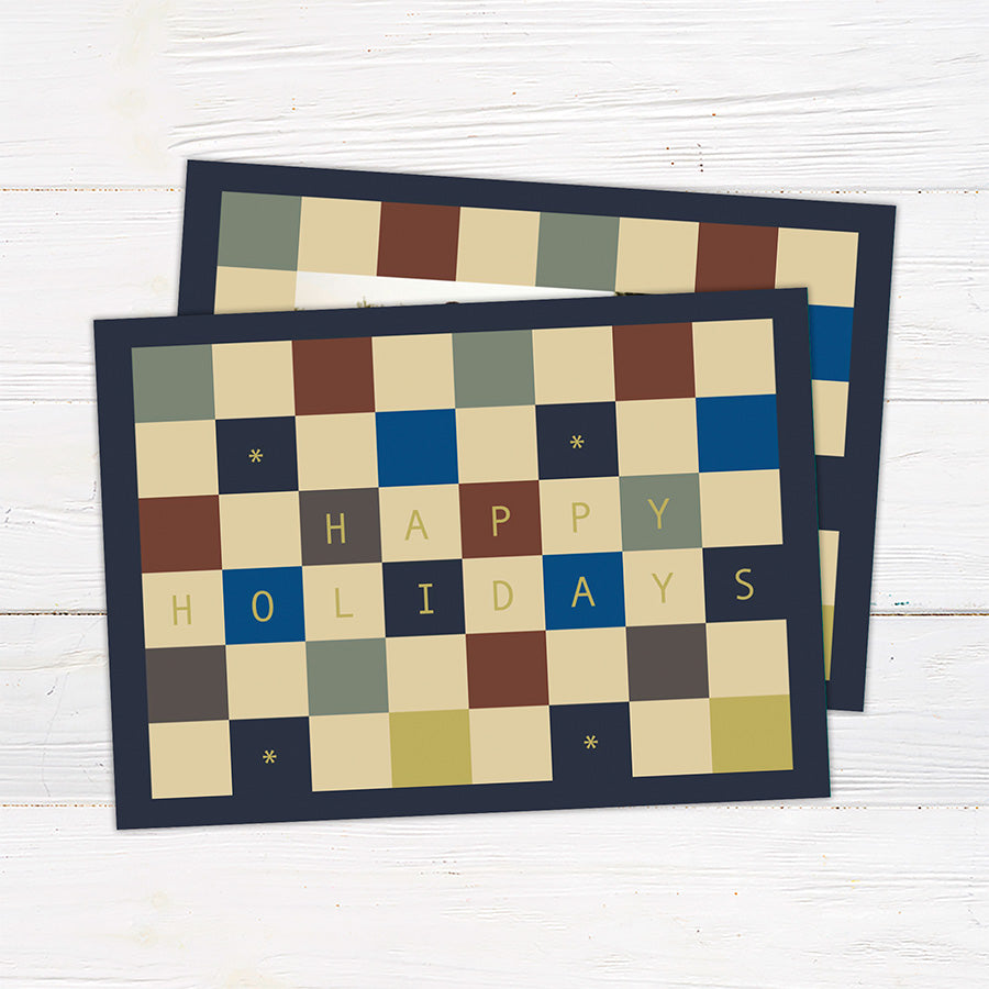 Personalized holiday card featuring a geometric color block pattern with a Happy Holidays greeting and custom family details. Coordinating options include a family photo layout and personalized seasonal message.