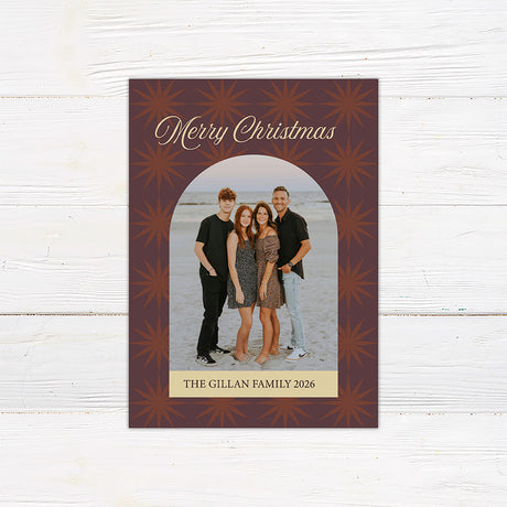 Personalized Christmas photo card featuring a family portrait framed by a retro starburst pattern and Merry Christmas greeting. The back includes coordinating starbursts with a Christmas and New Year message.