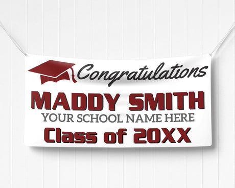 Custom graduation banner featuring bold graduate name, class year, and a mortarboard hat graphic. Ideal for high school or college graduation parties. burgundy and black