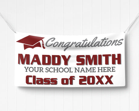 Custom graduation banner featuring bold graduate name, class year, and a mortarboard hat graphic. Ideal for high school or college graduation parties. burgundy and gray