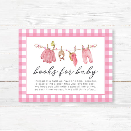 Books for baby insert card with a pink watercolor baby clothesline design. Encourages guests to bring a book instead of a card for the baby girl