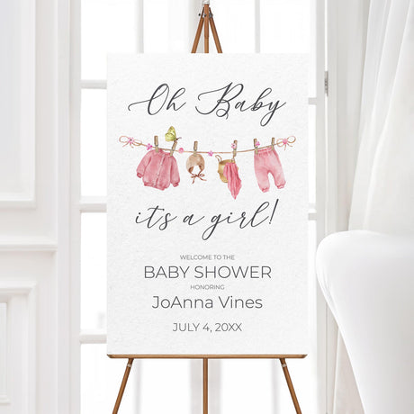 Pink baby shower welcome sign with a delicate baby clothesline illustration. Professionally printed and perfect for greeting guests at a baby girl shower