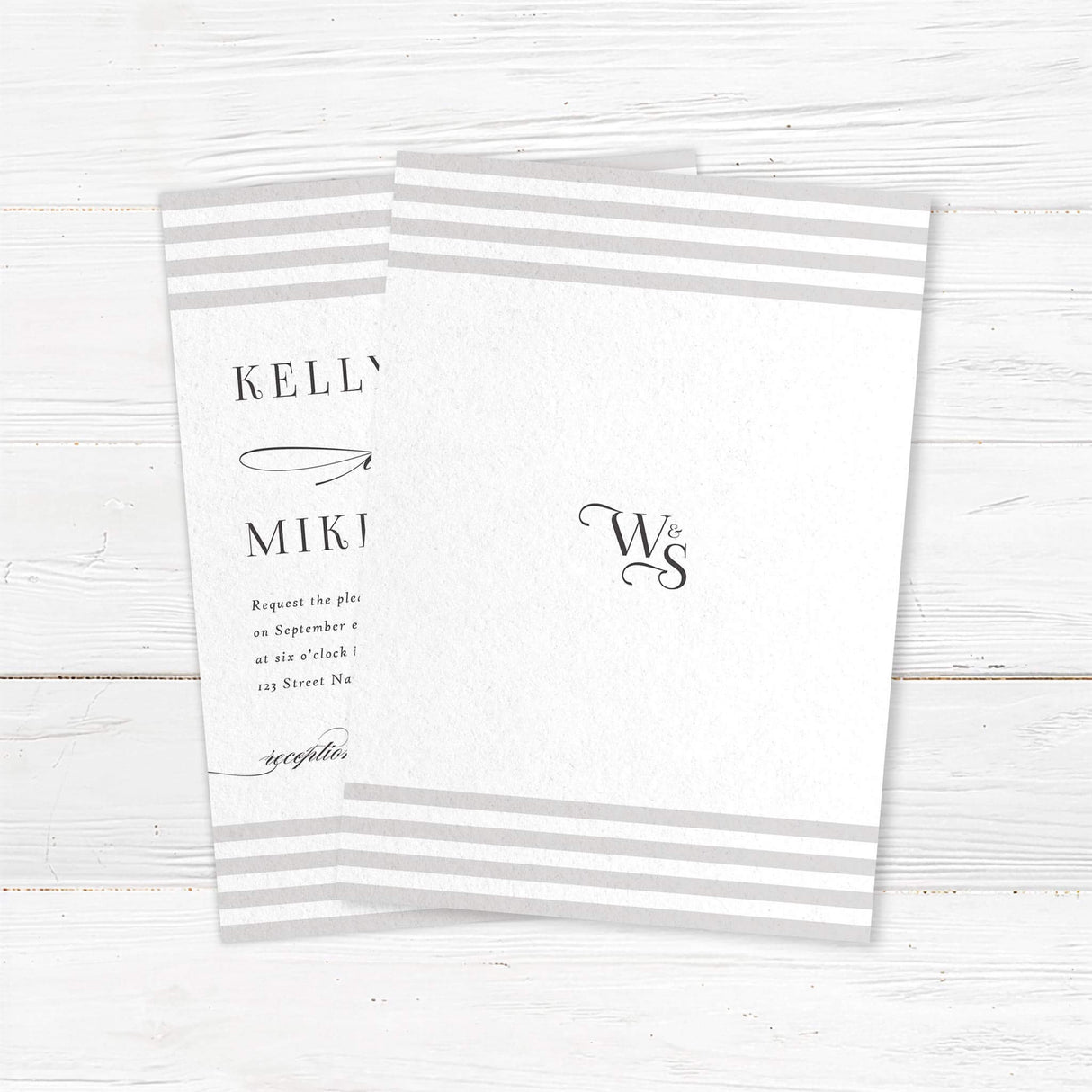 Wedding invitation featuring soft horizontal taupe and ivory stripes at the top and bottom, elegant serif fonts for names, romantic flourished script accents, and a white center panel. - back side
