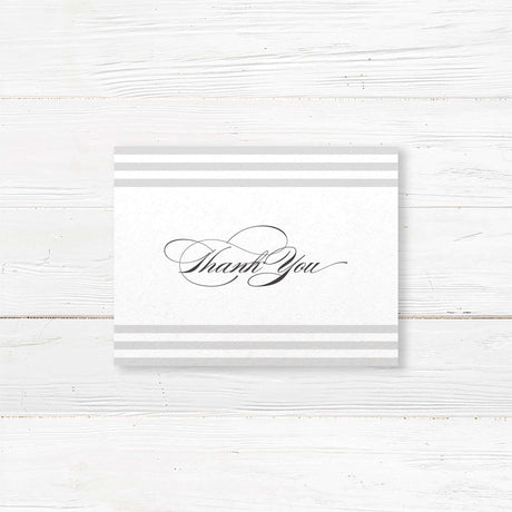 Wedding thank you card with soft horizontal taupe and ivory stripes, elegant serif and flourished script fonts, and minimalist layout, matching Paragraph Style stationery suite.