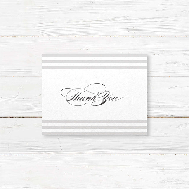 Wedding thank you card with soft horizontal taupe and ivory stripes, elegant serif and flourished script fonts, and minimalist layout, matching Paragraph Style stationery suite.