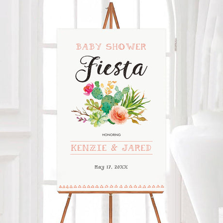 A pink cacti baby shower welcome sign with watercolor cactus and floral artwork. The design uses soft green, peach, and coral colors with modern lettering.