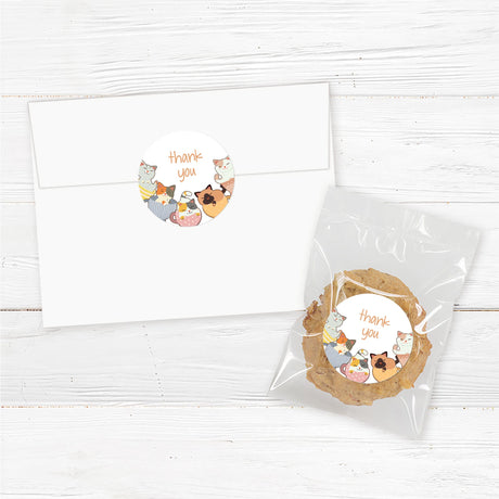 Printed baby shower favor stickers featuring illustrated kittens sitting inside teacups, adding a playful and whimsical touch to any baby shower favor. These professionally printed adhesive labels are perfect for sealing gift bags, mini candles, lip balms, or thank-you gifts. Available in multiple sizes for various favor packaging. Ideal for a tea party, cat lover, or gender-neutral baby shower theme.