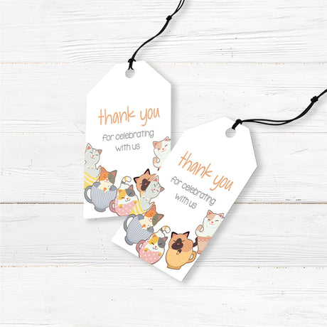Printed baby shower favor tags featuring cute kittens in teacups, designed to complement a cat-themed or tea party baby shower. These high-quality cardstock tags are pre-punched and pre-cut, making them easy to attach to favor bags, small candles, or handmade soaps. Professionally printed with a charming cat design, these tags are perfect for expressing gratitude to guests at any cat-themed, gender-neutral, or boho baby shower.