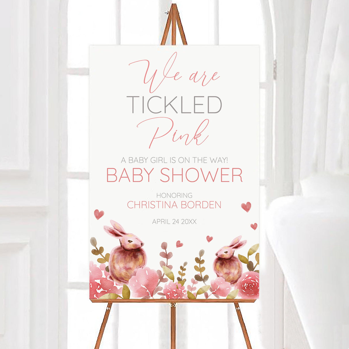 A Rabbits and Roses baby shower welcome sign with pink flowers and watercolor rabbits. The design uses soft pastel colors.