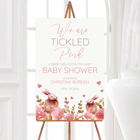 A Rabbits and Roses baby shower welcome sign with pink flowers and watercolor rabbits. The design uses soft pastel colors.