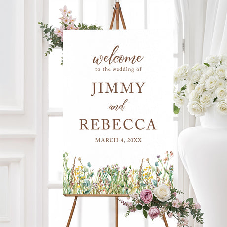 Elegant welcome sign with a minimalist design featuring delicate script and serif fonts. The bottom of the sign is adorned with a watercolor wildflower border, adding a rustic and romantic touch. The text warmly welcomes guests to the event in an elegant and heartfelt way. The color palette consists of soft neutrals and earth tones, creating a timeless and sophisticated look.