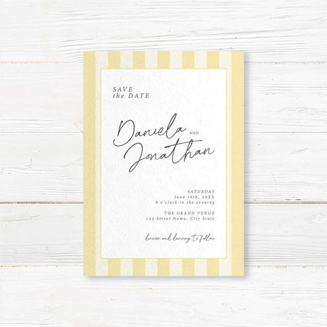 Save the Date card with vertical pale yellow and ivory stripes, minimalist white panel, and a mix of handwritten script and serif fonts to match the Simply Written suite.