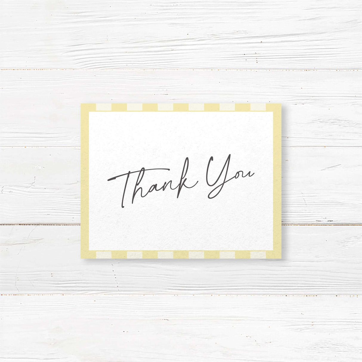 Wedding thank you card with pale yellow and ivory vertical stripes, minimalist white center, and a mix of handwritten and serif fonts to match the Simply Written suite.