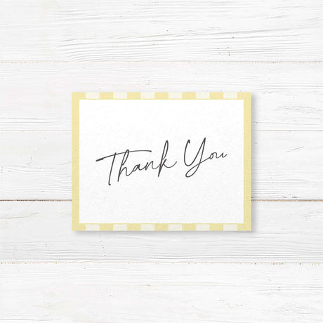 Wedding thank you card with pale yellow and ivory vertical stripes, minimalist white center, and a mix of handwritten and serif fonts to match the Simply Written suite.