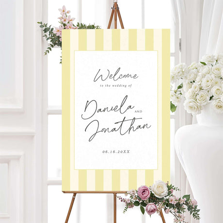 Wedding welcome sign with vertical pale yellow and ivory stripes, minimalist white center panel, and modern script and serif fonts from the Simply Written Soft Yellow Stripes suite.
